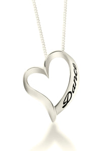 Forever Dance Heart Shaped Dancer necklace in 10 Karat White gold. An open heart with the word Dance embossed up the side hangs on a delicate white gold chain.